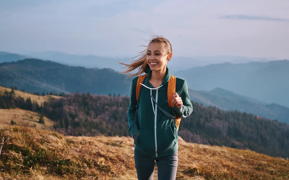 Young girl on day walk in hills in Queenstown, New Zealand