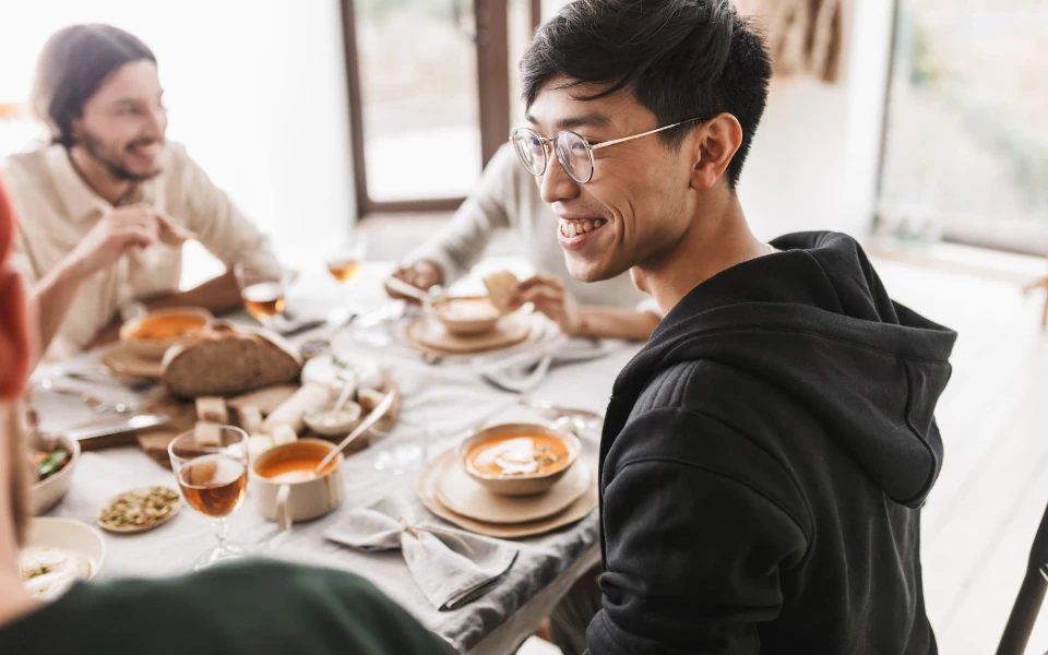 A group of friends out for breakfast around a dining table in Queenstown
